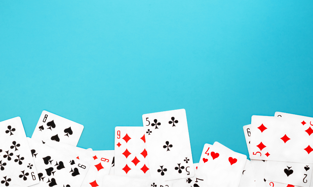 A deck of cards fanned out on a computer screen showcasing a variety of suits and numbers.
