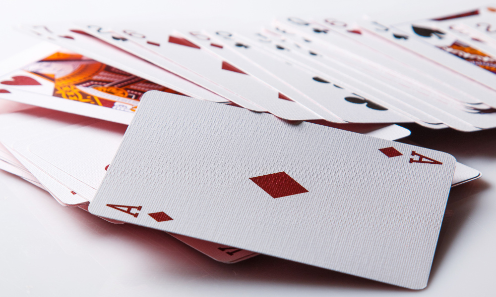 A deck of cards fanned out, showcasing a variety of suits and numbers